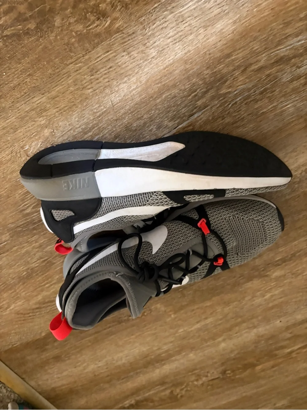 Nike Gray Mesh Running Shoes with White Swoosh and Red Interior